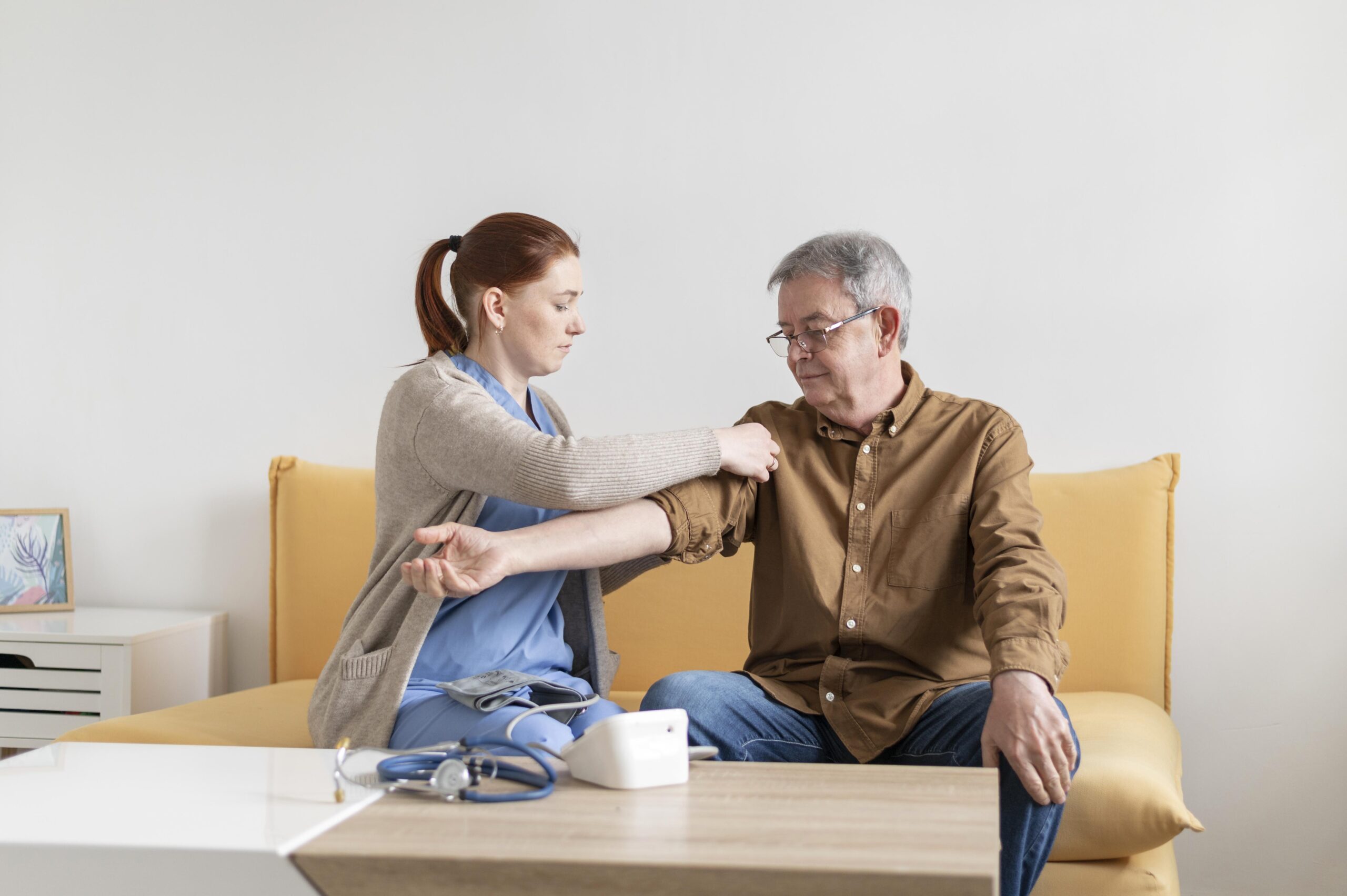 Nurse Talking To Senior Couple In Hospital Room